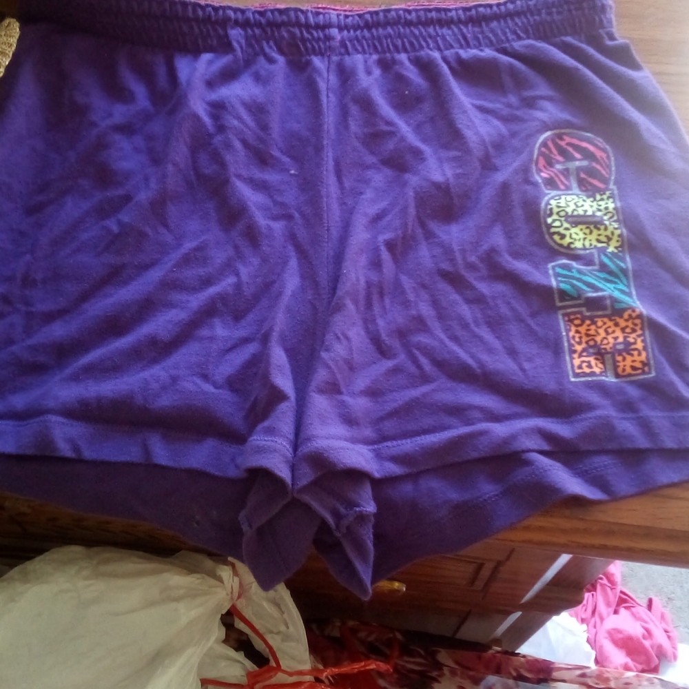 Purple shorts with the word cute on the side